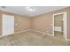 Spacious bedroom has carpet floors and closet with storage and shelves at 214 Kingsley Way, Woodstock, GA 30188