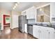 Updated kitchen with stainless steel appliances, granite countertops, and a stylish backsplash at 214 Kingsley Way, Woodstock, GA 30188