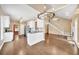 Open-concept kitchen with granite countertops, stainless steel appliances, and a view of the living area at 214 Kingsley Way, Woodstock, GA 30188