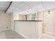 Basement bar area featuring white paneling, granite counter, and overhead lighting at 3131 Garden Lane Dr, Marietta, GA 30062