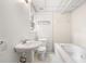 Bright bathroom with white fixtures, tiled walls, and a large soaking tub at 3131 Garden Lane Dr, Marietta, GA 30062
