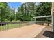 A spacious wooden deck offers a great view of the property's lush backyard and wooded area at 3131 Garden Lane Dr, Marietta, GA 30062