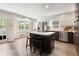 Modern kitchen with stainless steel appliances and a center island with bar stool seating at 3131 Garden Lane Dr, Marietta, GA 30062