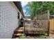 Exterior shot of a wooden back deck with steps, ideal for outdoor dining and relaxation at 3807 Greenhill Dr, Chamblee, GA 30341