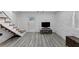 Finished basement featuring hard surface flooring, stairs, and natural light at 3807 Greenhill Dr, Chamblee, GA 30341