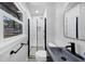 Modern bathroom with a walk-in shower, rain shower head, and sleek black fixtures at 3807 Greenhill Dr, Chamblee, GA 30341