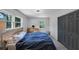 Bedroom features wood floors, and ensuite bathroom and natural light from the windows at 3807 Greenhill Dr, Chamblee, GA 30341