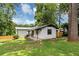 Charming single-story home with a landscaped yard and a welcoming front porch at 3807 Greenhill Dr, Chamblee, GA 30341