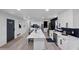 Spacious kitchen featuring an island with marble countertop and modern appliances at 3807 Greenhill Dr, Chamblee, GA 30341