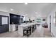 Open concept kitchen with island seating, stainless appliances, and adjacent living area at 3807 Greenhill Dr, Chamblee, GA 30341