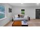 Cozy living room featuring hardwood floors, a sofa, and bright light at 3807 Greenhill Dr, Chamblee, GA 30341