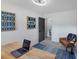 Well-lit office area with a sleek desk, blue rug, and unique modern art at 3807 Greenhill Dr, Chamblee, GA 30341