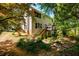 Exterior of home showcasing a deck, backyard, lush landscaping, and multi-level yard at 515 Rosedown Way, Lawrenceville, GA 30043