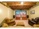 Cozy basement media space includes a projector screen, plush seating, and wood accents at 515 Rosedown Way, Lawrenceville, GA 30043
