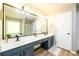 Stylish bathroom with a double sink vanity, a large mirror, and modern fixtures at 515 Rosedown Way, Lawrenceville, GA 30043