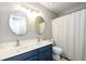 Bathroom with a double sink vanity and shower with tub at 515 Rosedown Way, Lawrenceville, GA 30043