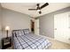 Bedroom featuring a ceiling fan and neutral paint at 515 Rosedown Way, Lawrenceville, GA 30043