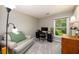 Cozy bedroom with a large window and a comfortable sitting area at 515 Rosedown Way, Lawrenceville, GA 30043