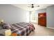 Comfortable bedroom with a ceiling fan, large window, and neutral paint at 515 Rosedown Way, Lawrenceville, GA 30043