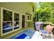 Exterior view from deck showing outdoor furniture, grill, and view into the backyard at 515 Rosedown Way, Lawrenceville, GA 30043