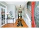 Welcoming foyer with hardwood floors, a staircase, neutral walls, and a view into other rooms at 515 Rosedown Way, Lawrenceville, GA 30043