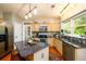 Well-lit kitchen featuring granite countertops, stainless appliances, and a functional island with seating at 515 Rosedown Way, Lawrenceville, GA 30043