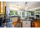 Bright kitchen open to the living room showcasing granite countertops, hardwood floors, and natural light at 515 Rosedown Way, Lawrenceville, GA 30043