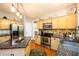 Functional kitchen featuring stainless appliances, granite countertops, and ample storage space at 515 Rosedown Way, Lawrenceville, GA 30043