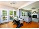 Open dining space with natural light and views to a cozy living room with fireplace feature at 515 Rosedown Way, Lawrenceville, GA 30043