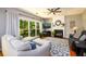 Comfortable living room with natural light and a traditional fireplace feature at 515 Rosedown Way, Lawrenceville, GA 30043