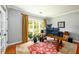 Bright office space with hardwood floors, a large window, and a view of the outdoors, perfect for work or study at 515 Rosedown Way, Lawrenceville, GA 30043