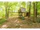 Backyard playhouse features a swing set, slide, and elevated platform at 515 Rosedown Way, Lawrenceville, GA 30043