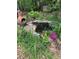 Backyard with a pond and planted containers at 515 Rosedown Way, Lawrenceville, GA 30043