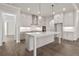 Open kitchen with a large island, stainless steel appliances, and ample counter space at 517 Godfrey Dr, Cumming, GA 30040