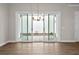 Living room with sliding glass doors that open to an outdoor patio and garden at 517 Godfrey Dr, Cumming, GA 30040