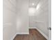 Walk-in closet with wood-look floors and ample wire shelving for storage at 517 Godfrey Dr, Cumming, GA 30040