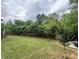 Expansive backyard features a lush lawn, privacy fence, and mature trees at 5305 Redfield Way, Cumming, GA 30028