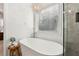 Lovely bathroom showcasing a freestanding tub, elegant chandelier, and natural light at 5305 Redfield Way, Cumming, GA 30028