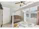 Bright bedroom with a crib and decorative bed canopy, complimented by natural light from the window at 5305 Redfield Way, Cumming, GA 30028