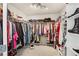Walk-in closet featuring ample shelving, metal racks, and excellent storage space for an organized wardrobe at 5305 Redfield Way, Cumming, GA 30028