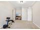 Home gym with a wall-mounted TV, weight-lifting equipment, and neutral-colored walls at 5305 Redfield Way, Cumming, GA 30028