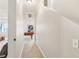 Hallway leading to a game room, featuring carpeted floors and neutral-colored walls at 5305 Redfield Way, Cumming, GA 30028