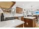 Modern kitchen featuring stainless steel appliances, a gas range, and an island with white countertop at 5305 Redfield Way, Cumming, GA 30028