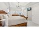 Bright main bedroom with a decorative bed frame, modern ceiling, and bright natural light at 5305 Redfield Way, Cumming, GA 30028