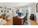 Charming home office featuring two large windows, custom built-in storage, and a comfortable workspace at 5305 Redfield Way, Cumming, GA 30028