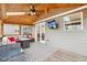Cozy screened-in patio with a wood ceiling, an outdoor television, and elegant patio furniture at 5305 Redfield Way, Cumming, GA 30028