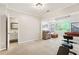 Spacious recreation room with a game area, bathroom, exercise bike and comfortable seating at 5305 Redfield Way, Cumming, GA 30028