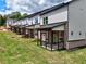 New construction townhomes each boast a private covered patio and a well-maintained backyard at 5720 Urban Village Way # 7, Tucker, GA 30084