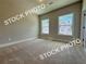 Vaulted ceiling bedroom with carpet, two windows and neutral walls at 5720 Urban Village Way # 7, Tucker, GA 30084