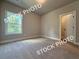 Comfortable bedroom with large window and a closet at 5720 Urban Village Way # 7, Tucker, GA 30084
